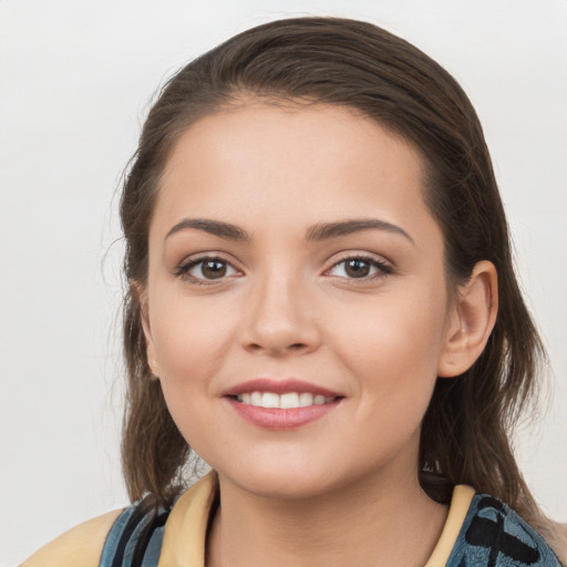 Joyful white young-adult female with medium  brown hair and brown eyes