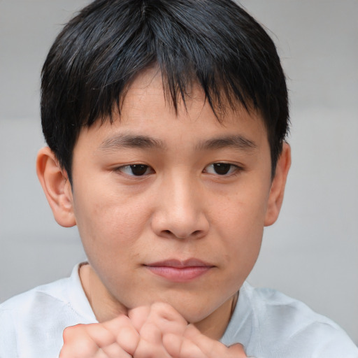 Neutral asian child male with short  brown hair and brown eyes