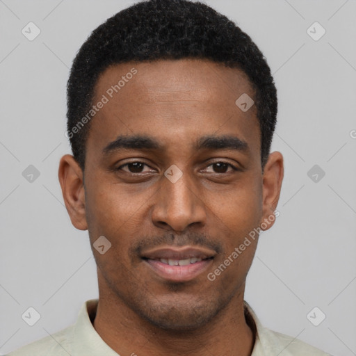 Joyful black young-adult male with short  black hair and brown eyes