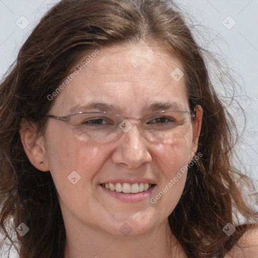 Joyful white adult female with long  brown hair and brown eyes