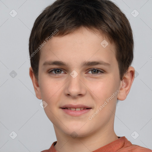 Joyful white child male with short  brown hair and grey eyes