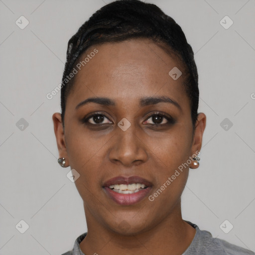 Joyful black young-adult female with short  black hair and brown eyes