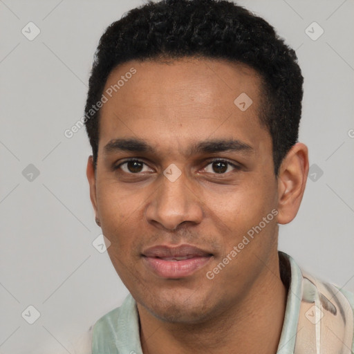 Joyful latino young-adult male with short  black hair and brown eyes