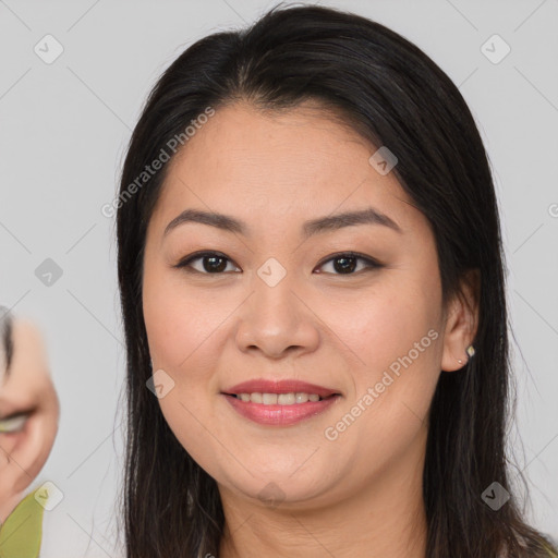 Joyful asian young-adult female with long  brown hair and brown eyes