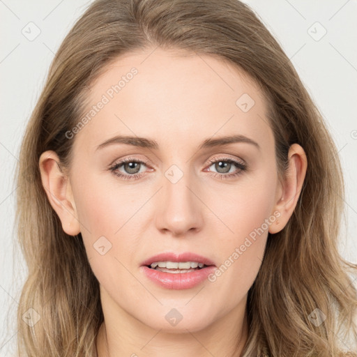 Joyful white young-adult female with long  brown hair and blue eyes