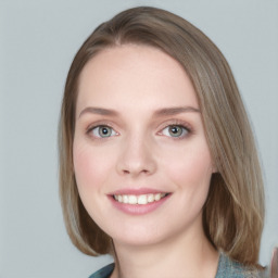 Joyful white young-adult female with medium  brown hair and blue eyes