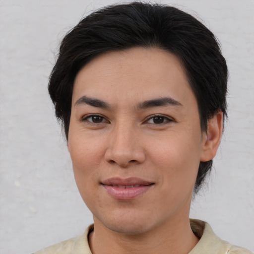 Joyful asian young-adult female with medium  brown hair and brown eyes