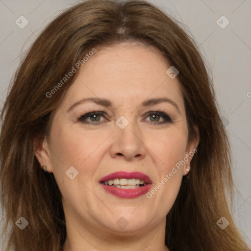 Joyful white adult female with long  brown hair and brown eyes