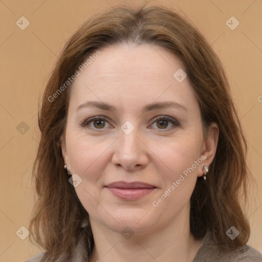 Joyful white adult female with medium  brown hair and brown eyes