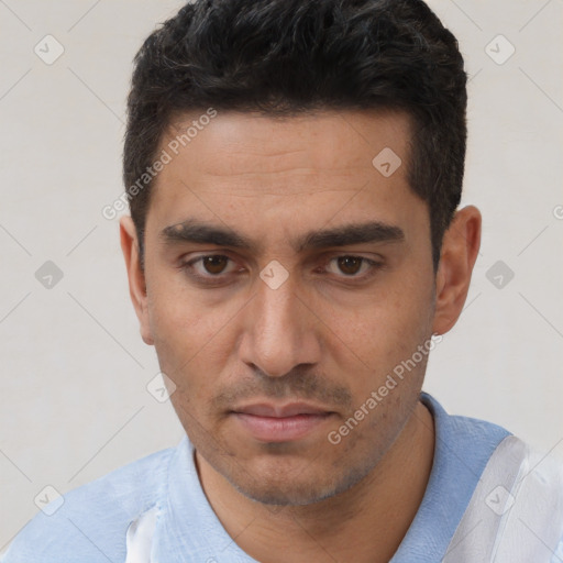 Joyful white young-adult male with short  black hair and brown eyes