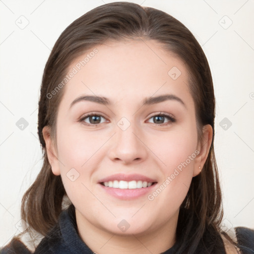 Joyful white young-adult female with long  brown hair and grey eyes