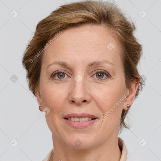 Joyful white adult female with short  brown hair and grey eyes