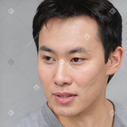 Neutral asian young-adult male with short  black hair and brown eyes