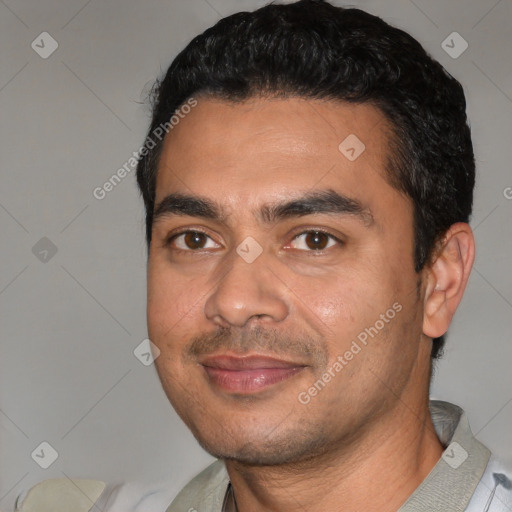 Joyful white young-adult male with short  black hair and brown eyes