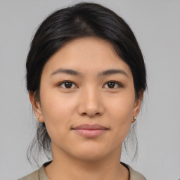 Joyful asian young-adult female with medium  black hair and brown eyes