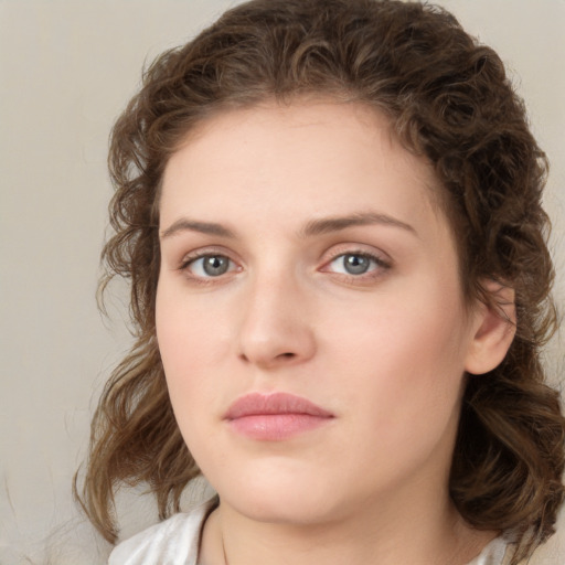 Neutral white young-adult female with medium  brown hair and green eyes