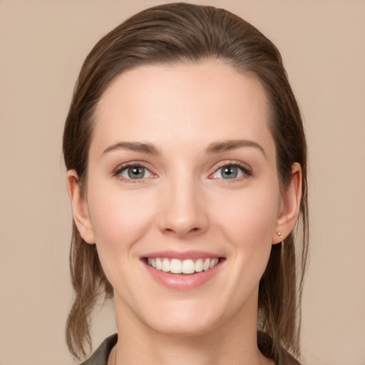 Joyful white young-adult female with long  brown hair and grey eyes