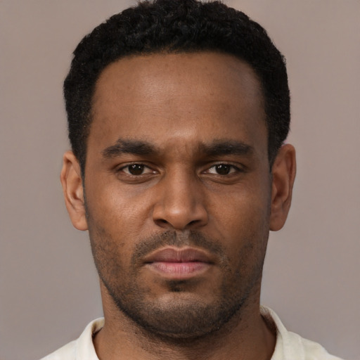 Neutral black young-adult male with short  black hair and brown eyes