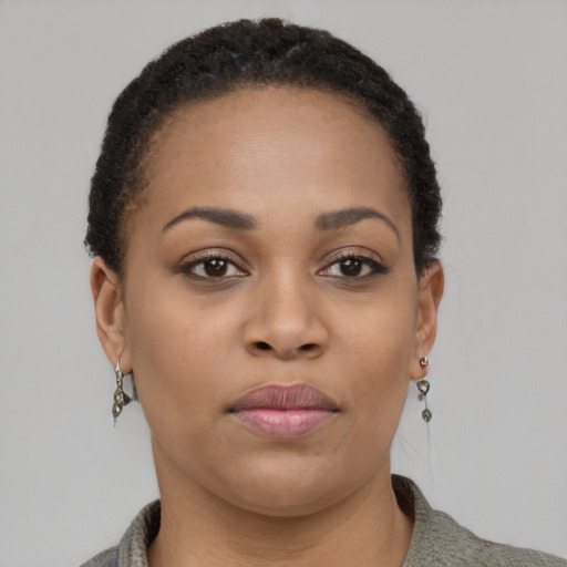 Neutral black young-adult female with short  black hair and brown eyes