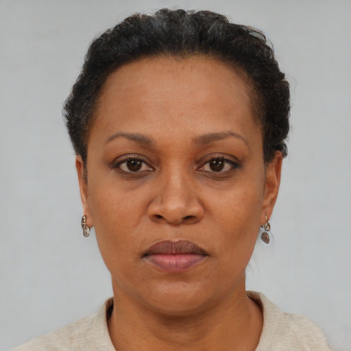 Neutral black adult female with short  brown hair and brown eyes