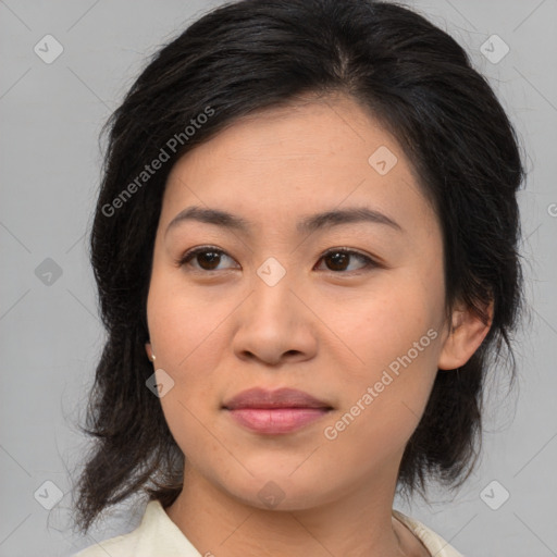 Joyful asian young-adult female with medium  brown hair and brown eyes