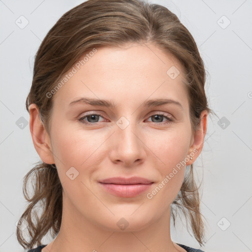 Joyful white young-adult female with medium  brown hair and grey eyes