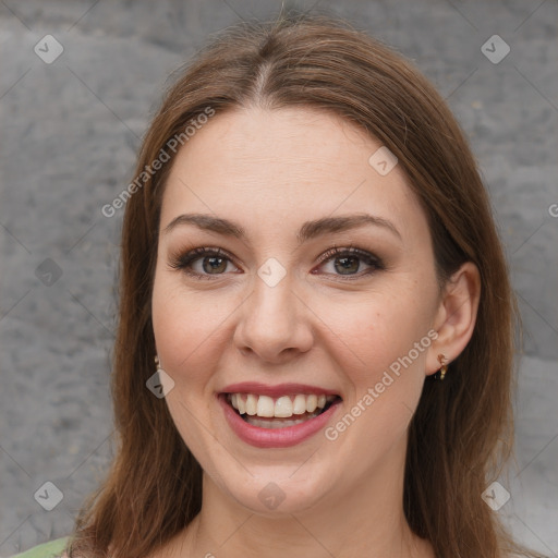 Joyful white young-adult female with medium  brown hair and green eyes