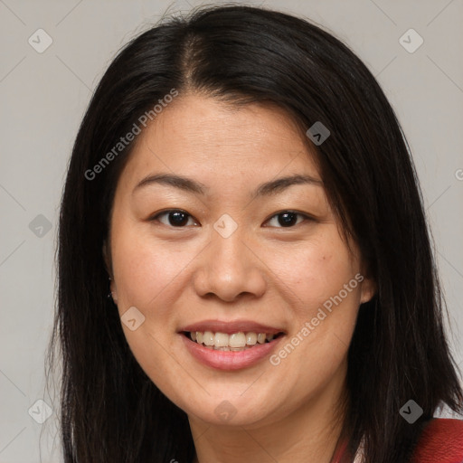 Joyful asian young-adult female with long  brown hair and brown eyes