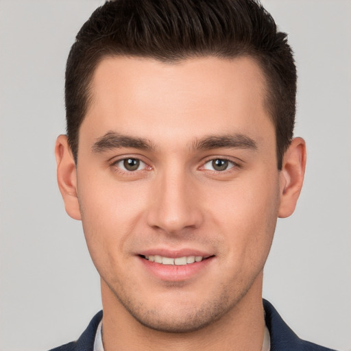 Joyful white young-adult male with short  brown hair and brown eyes