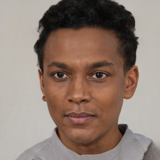 Neutral black young-adult male with short  black hair and brown eyes