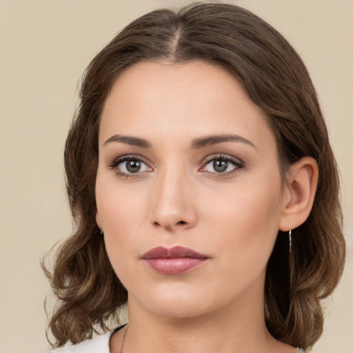 Neutral white young-adult female with medium  brown hair and brown eyes