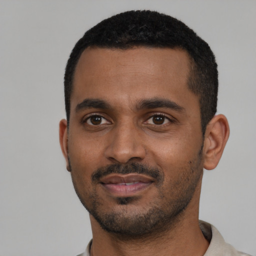 Neutral black young-adult male with short  black hair and brown eyes