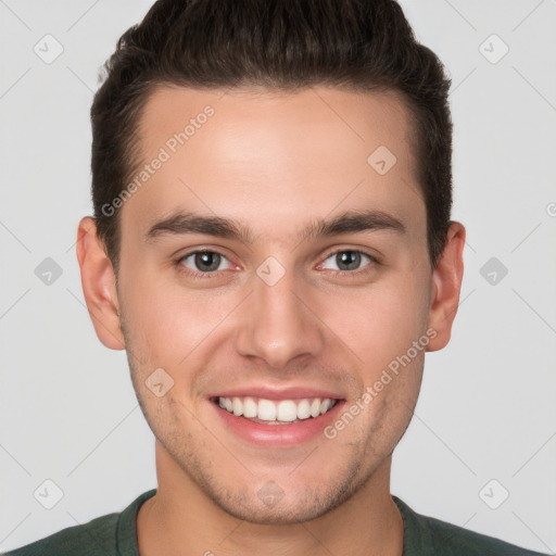 Joyful white young-adult male with short  brown hair and brown eyes