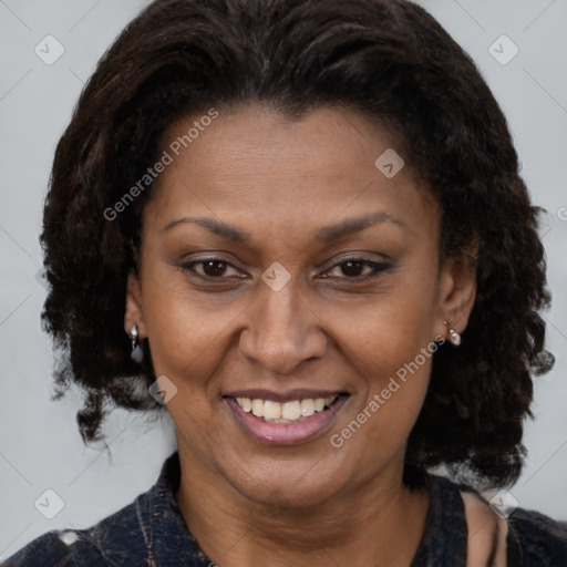 Joyful black adult female with medium  brown hair and brown eyes