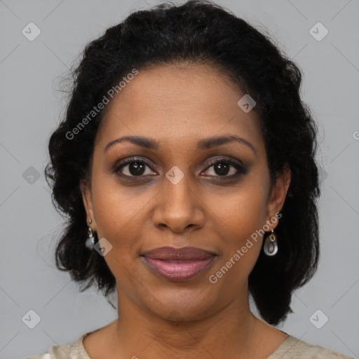 Joyful black adult female with short  brown hair and brown eyes