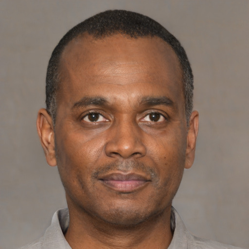 Neutral black adult male with short  black hair and brown eyes