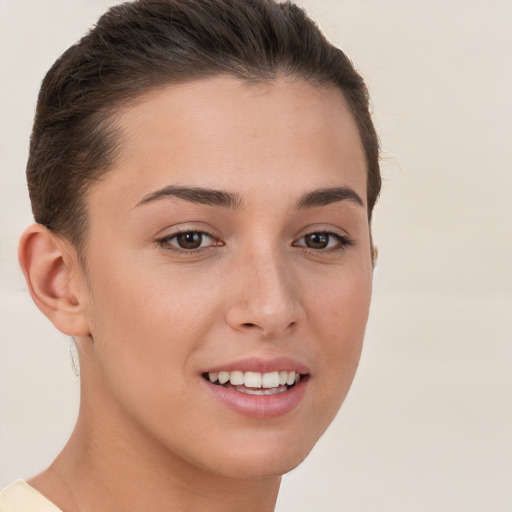 Joyful white young-adult female with short  brown hair and brown eyes