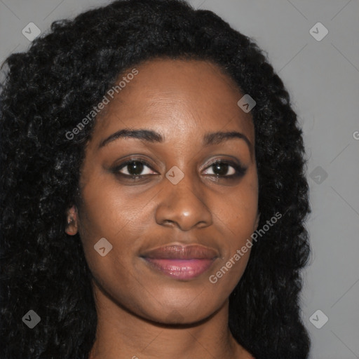 Joyful black young-adult female with long  brown hair and brown eyes