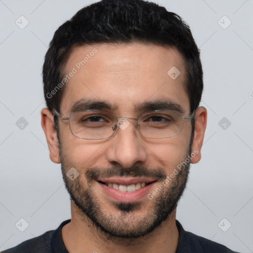 Joyful white adult male with short  black hair and brown eyes