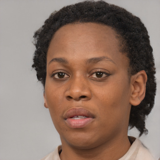 Neutral black adult female with short  brown hair and brown eyes