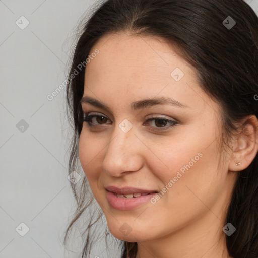 Joyful white young-adult female with long  brown hair and brown eyes