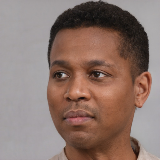 Neutral latino young-adult male with short  brown hair and brown eyes