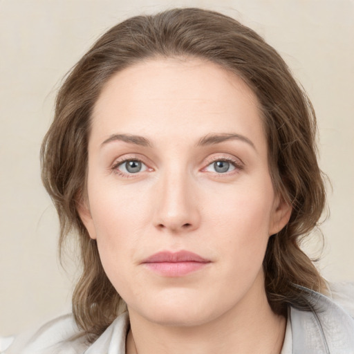 Neutral white young-adult female with medium  brown hair and green eyes