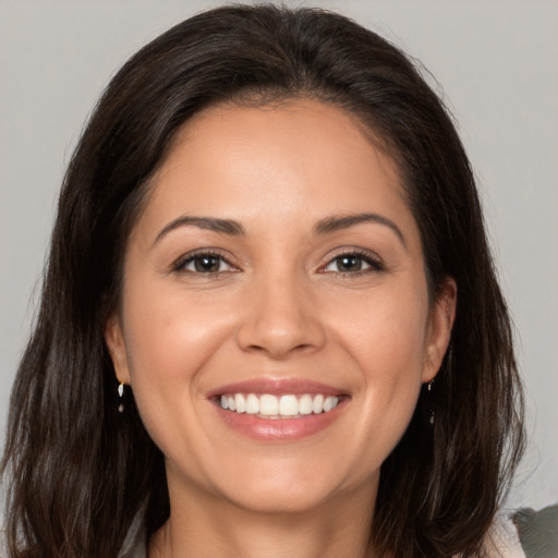 Joyful white young-adult female with medium  brown hair and brown eyes