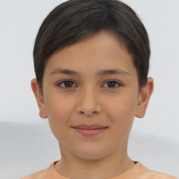 Joyful white child female with short  brown hair and brown eyes