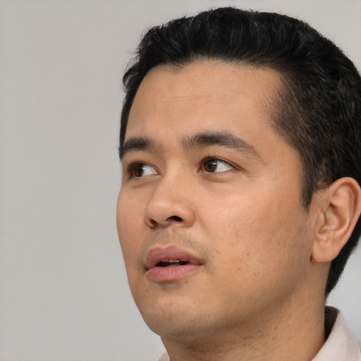 Neutral asian young-adult male with short  black hair and brown eyes