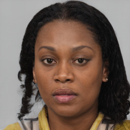 Neutral black young-adult female with medium  brown hair and brown eyes