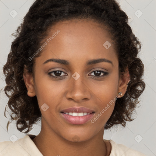 Joyful black young-adult female with long  brown hair and brown eyes