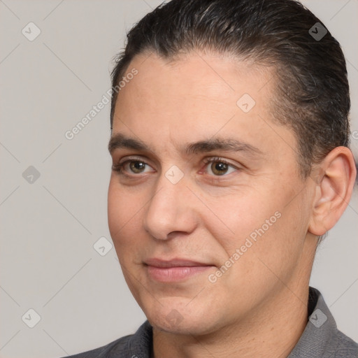 Joyful white adult male with short  brown hair and brown eyes