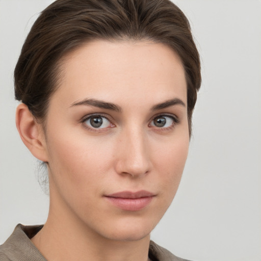 Neutral white young-adult female with short  brown hair and brown eyes